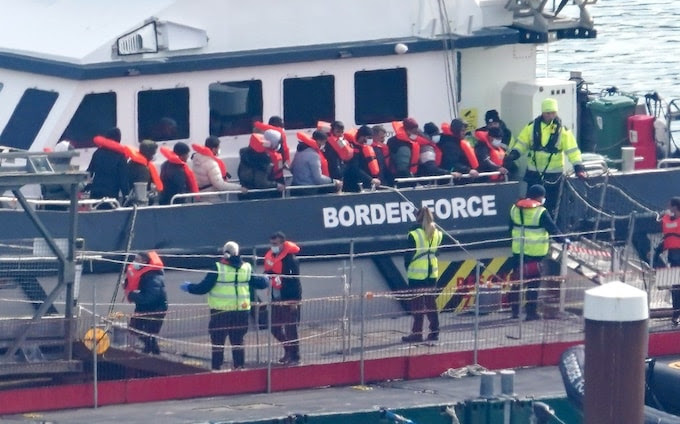 A group of people thought to be migrants are brought ashore at Dover, Kent, on Monday