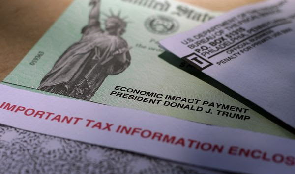 Then-President Donald J. Trump&#x27;s name is printed on a stimulus check issued by the IRS to help combat the adverse economic effects of the COVID-19 outbreak in this April 23, 2020 photo taken in San Antonio. Early in the pandemic, government relief checks became an attractive target for criminals. A federal inspector general sent a stark warning to Congress, saying they are leaving a massive amount of stolen taxpayer money in scammers&#x27; pockets because lawmakers haven&#x27;t extended the statute of limitation on pandemic unemployment fraud. (AP Photo/Eric Gay, File)