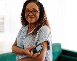 woman checking her blood sugar level