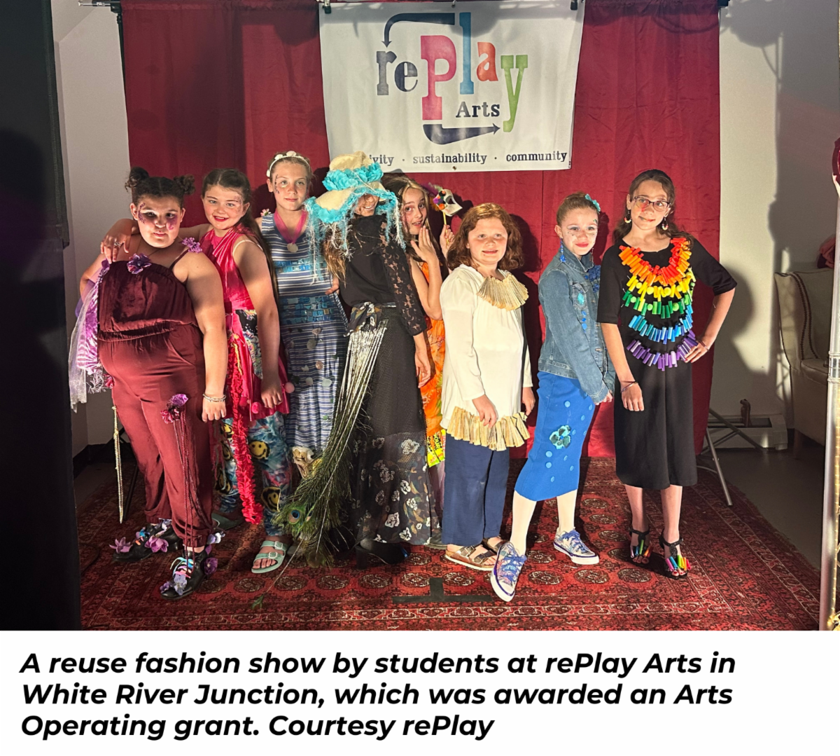 A group of young students post during a reuse fashion show at rePlay Arts in White River Junction, which was awarded an Arts Operating grant.