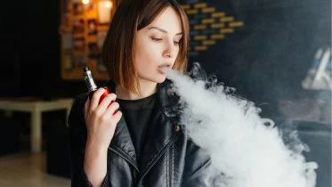 Woman Vaping Holding Vape