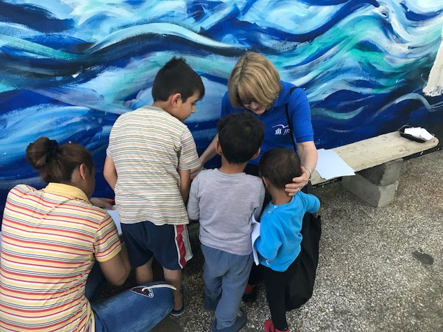 Joan with children in JRS Greece