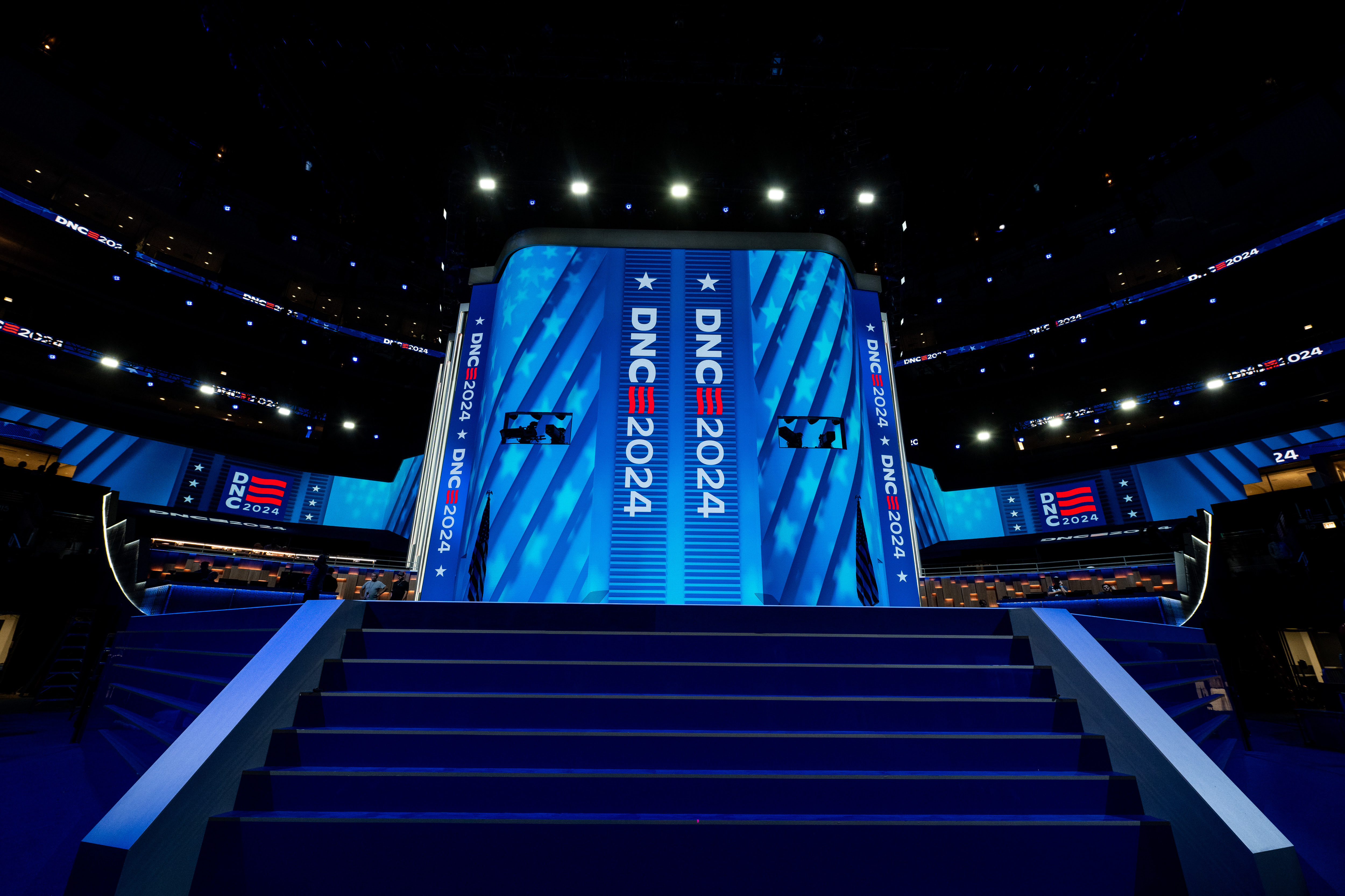 stairs leading to the stage of the Democratic National Convention, with blue stars and stripes on LED screens