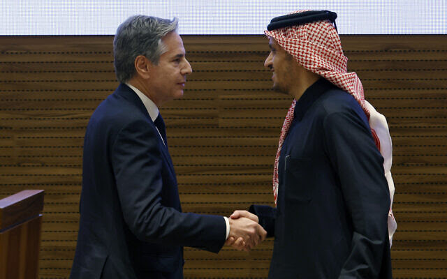 Qatar's Prime Minister and Foreign Minister Sheikh Mohammed bin Abdulrahman al-Thani (R) and US Secretary of State Antony Blinken shake hands during a press conference following a meeting in Doha on January 7, 2024. (Karim JAAFAR / AFP)