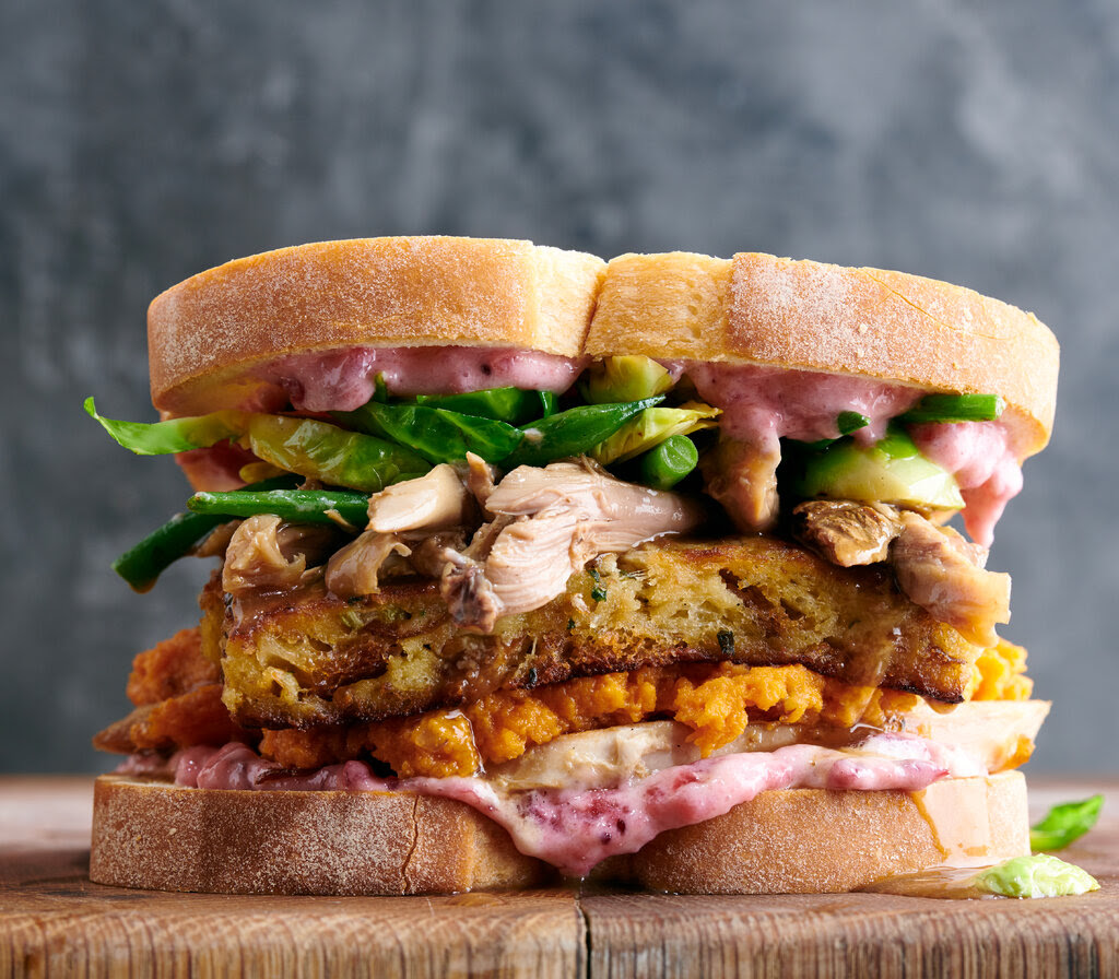 A fully loaded sandwich of Thanksgiving leftovers.