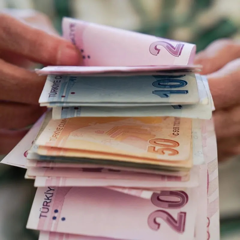 A Person Counting Turkish Lira Notes, The National Currency Of Turkiye