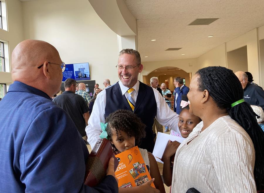 Pastor Clint Pressley greets worshippers after a service at Hickory Grove Baptist Church.