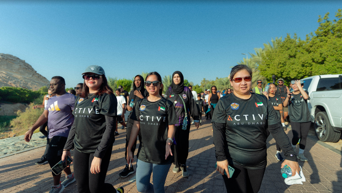 A group of women walking on a brick pathDescription automatically generated