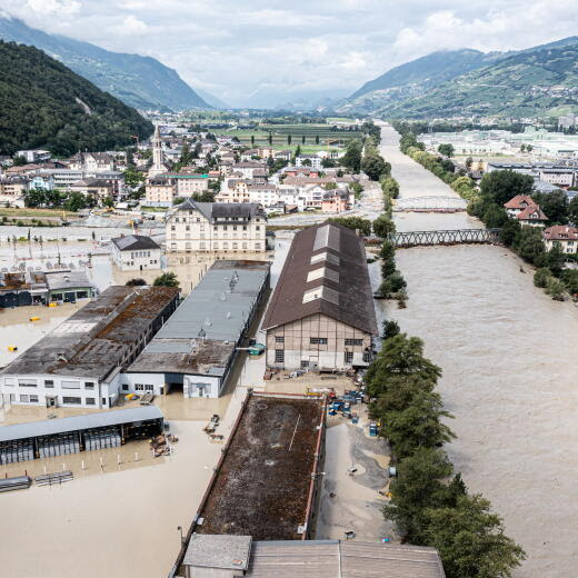 epa11446865 Rhone River and the Navizence river overflow the industrial area following storms that caused major flooding, in Chippis, Switzerland, 30 June 2024. EPA/OLIVIER MAIRE