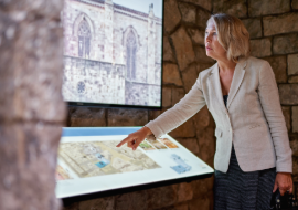 Woman uses digital display at museum