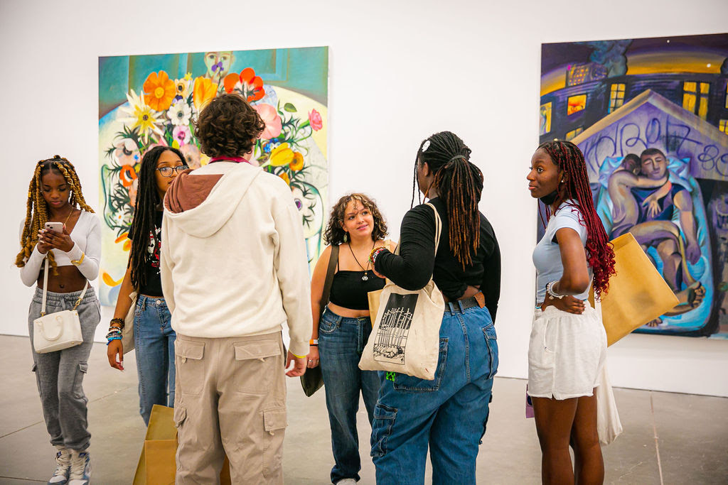 A group of teens in the gallery