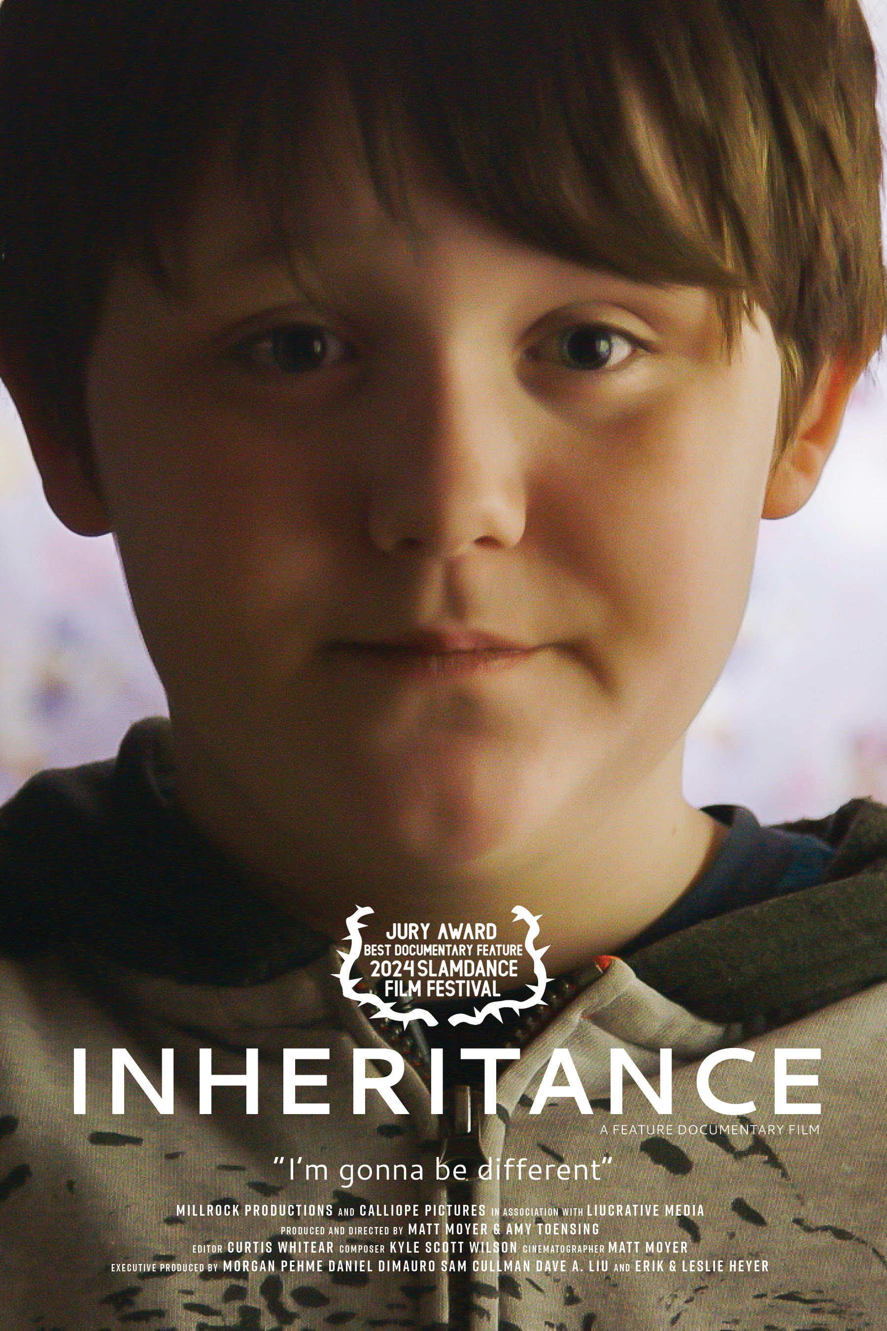 A close-up of a young boy with a calm and serious expression, set against a softly blurred background. The title ''INHERITANCE'' is prominently displayed in white text at the bottom, with the tagline ''I'm gonna be different'' beneath it. Above the title, an emblem announces the ''Jury Award Best Documentary Feature 2024 Slamdance Film Festival.'' Additional production details, including directors and producers, are listed in smaller text below the title.