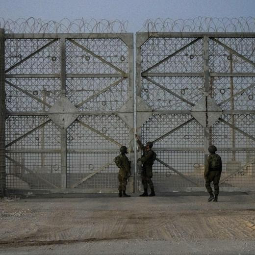 CORRECTS TO SOUTHERN ISRAEL - Israeli soldiers close the gate of Erez Crossing after trucks carrying humanitarian aid entered the Gaza Strip, in southern Israel, Monday, Oct. 21, 2024. (AP Photo/Tsafrir Abayov)