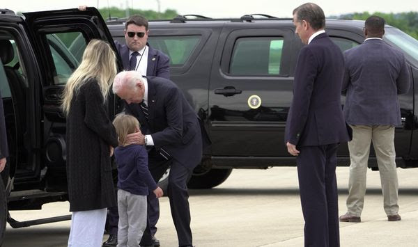 President Joe Biden greets his grandson Beau Biden as Hunter Biden and wife Melissa Cohen Biden watch, at Delaware Air National Guard Base in New Castle, Del., Tuesday, June 11, 2024. (AP Photo/Manuel Balce Ceneta)