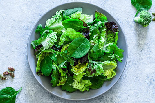 Adding dark leafy greens to your salad can help diversify your diet. fcafotodigital/Getty Images