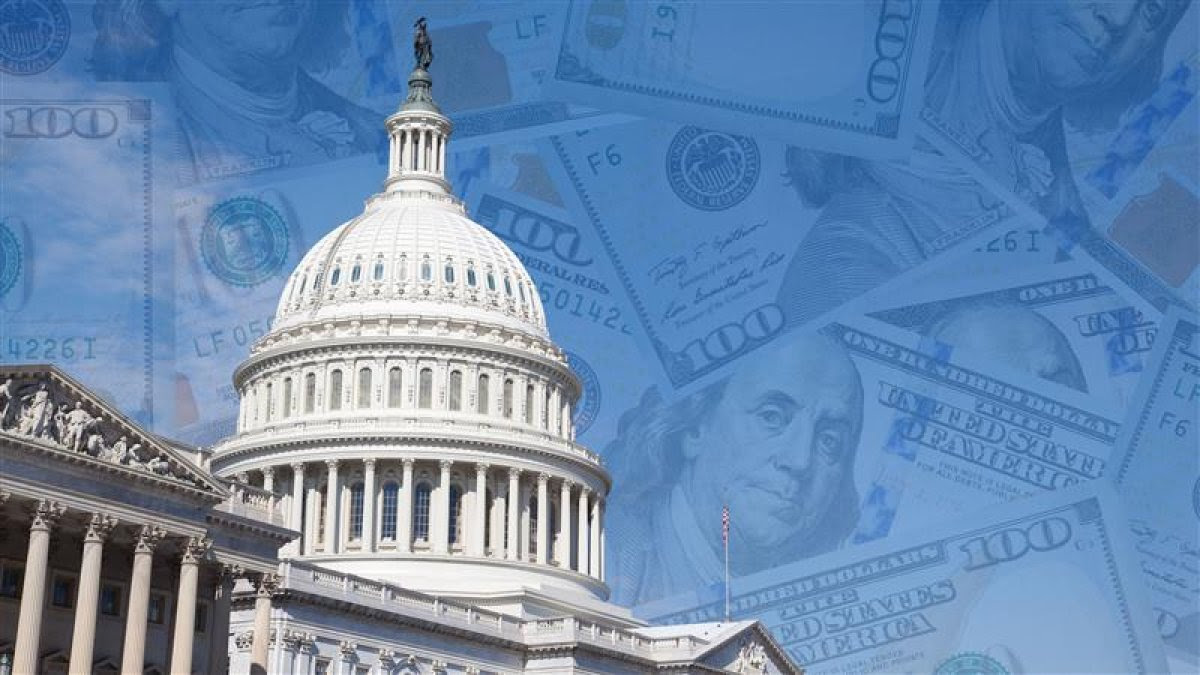 An image of the US Capitol with $100 bills floating in the background 