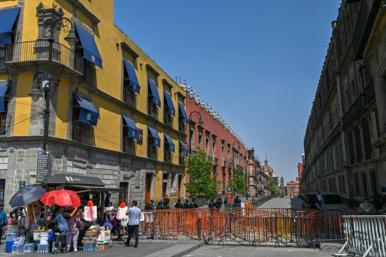 The camera is level but the buildings in the Zocalo are not. Notice the riot police at the bottom behind the barriers. The building to the right is the National Palace where protests are frequent.