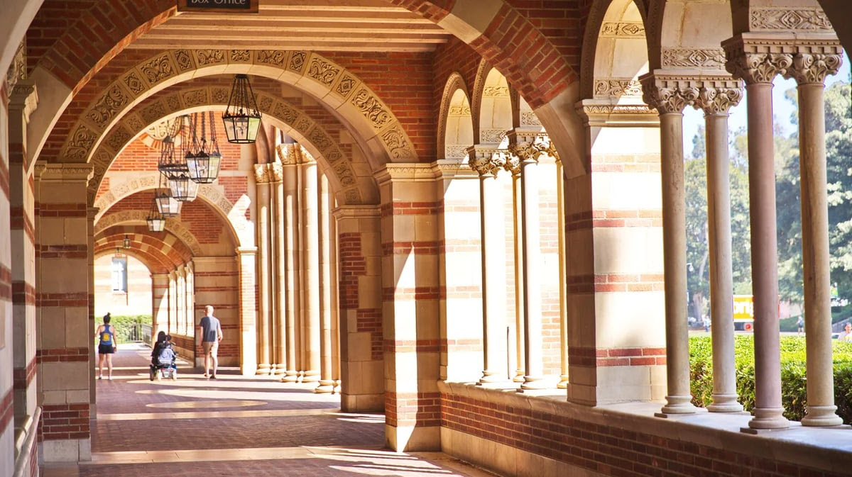 A person in a wheelchair travels through the corridor of Royce Hall at UCLA. Photo by Shutterstock.