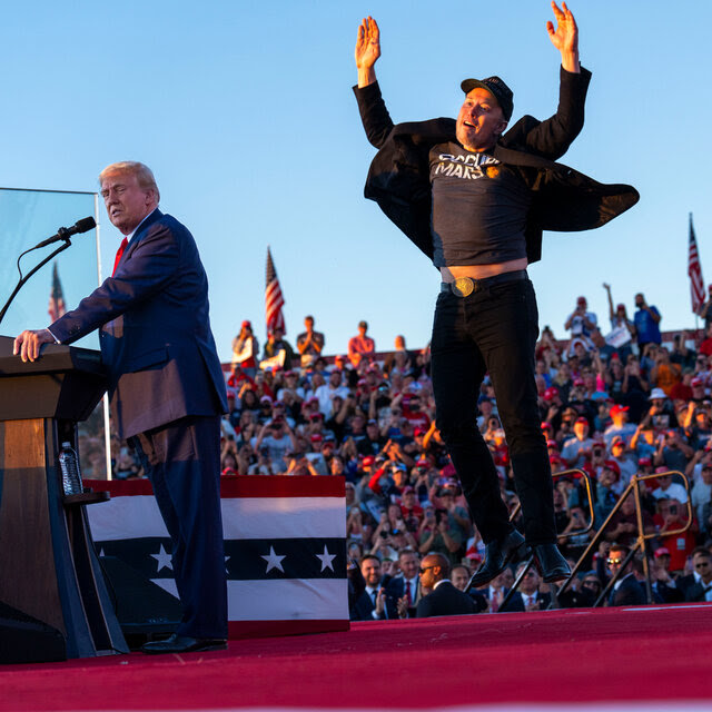 Elon Musk leaps into the air onstage, while former President Donald J. Trump speaks to the rally crowd in Butler, Pa.