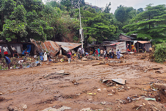 On a muddy street in the Ngaliema district of Kinshasa, residents attempt to salvage some belongings after floods destroyed homes and businesses in their neighborhood following torrential rains on June 14. Four United Methodists were among the nearly 30 people who lost their lives in the floods. Photo by the Rev. Fiston Okito, UM News.