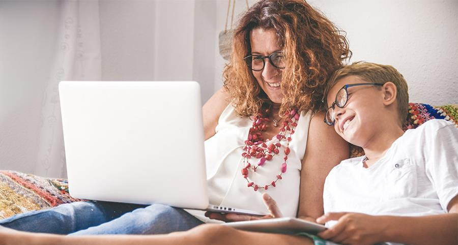 Parent on the computer with their child