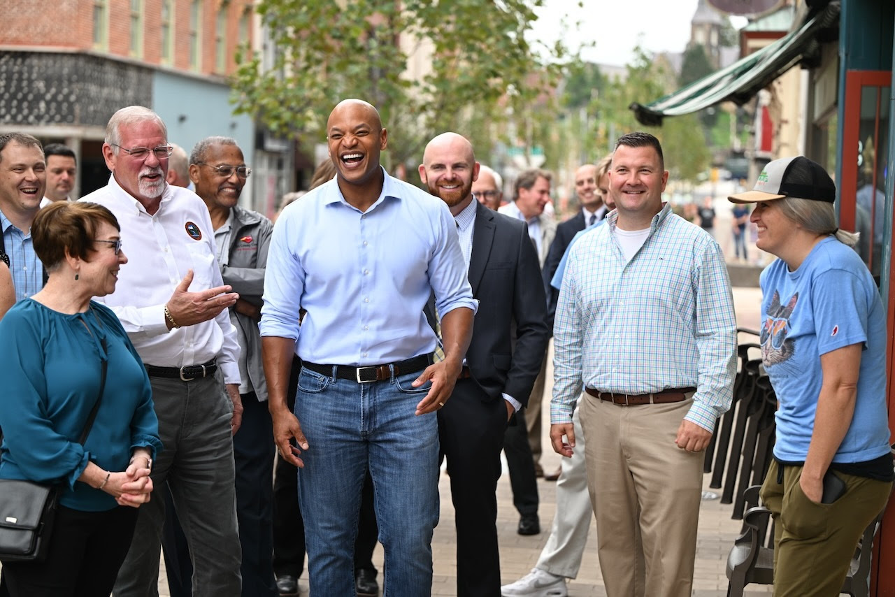 Governor Wes Moore, Cumberland Mayor Raymond M. Morriss, and business owners and developers take a walking tour of the Baltimore