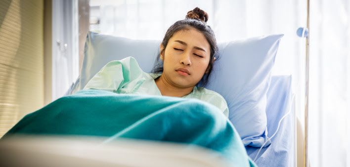 Patient with illness in hospital room