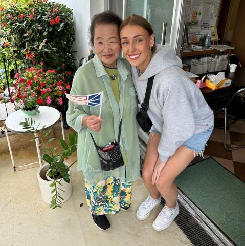 Sophie with Rev. Omo, previous minister and mother of current minister at Myakojima Church, with the Newfoundland flag.