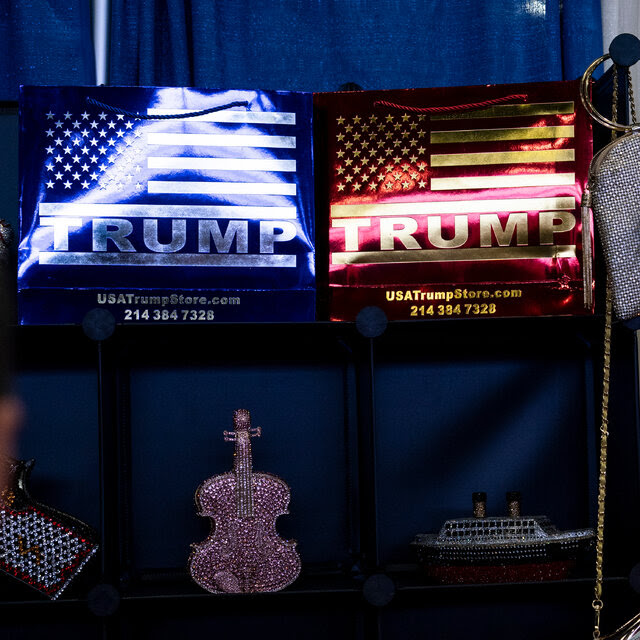 Two displays showing American flags with "Trump" overlaid on them.