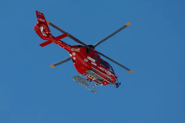 <p>AP Photo/Alessandro Trovati</p> A helicopter flies evacuating United States' Mikaela Shiffrin after she crashed during an alpine ski, women's World Cup downhill race, in Cortina d'Ampezzo, Italy, Friday, Jan. 26, 2024. Shiffrin crashed into the safety nets after losing control landing a jump during a World Cup women's downhill on Friday.