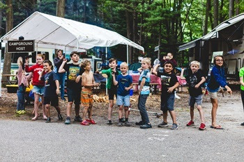 a group of about a dozen boys and girls stand in a line, ready to launch their crafty "bats" as part of Hoffmaster State Park's Bats Bats Bats program