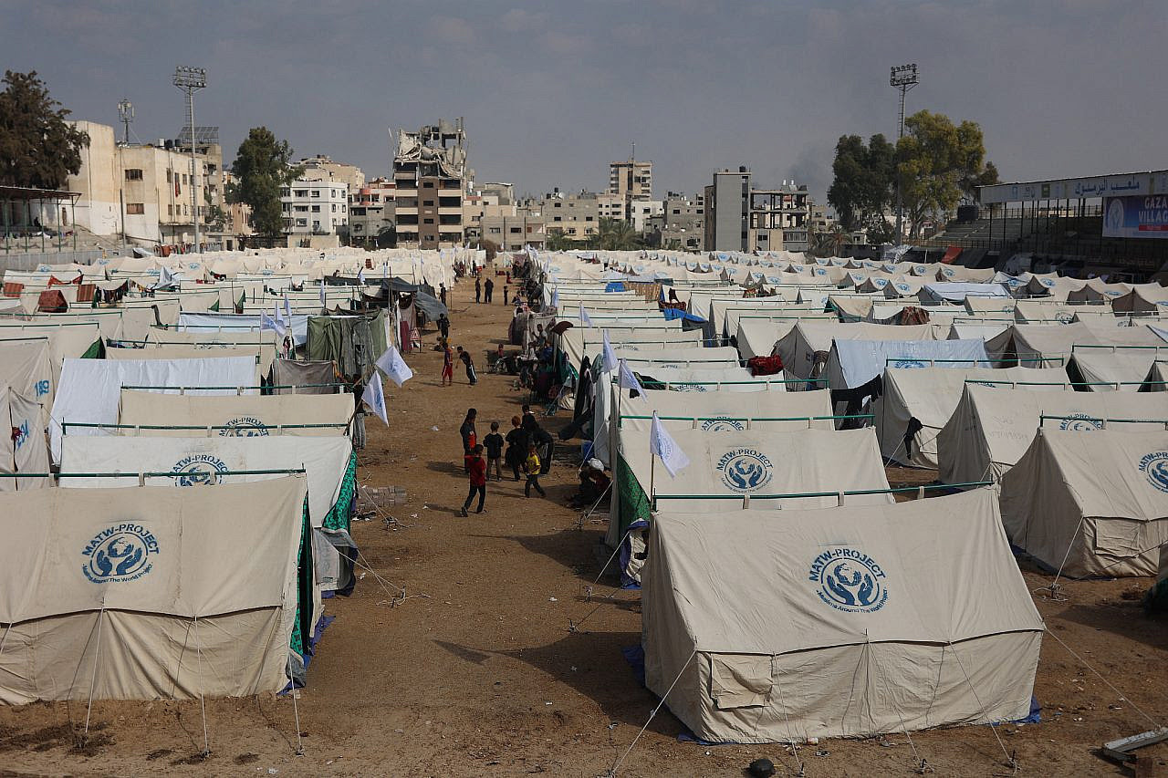 Palestinians displaced from Jabalia, Beit Lahiya, and Beit Hanoun shelter in tents at a stadium in Gaza City, November 1, 2024. (Omar Al-Qataa)