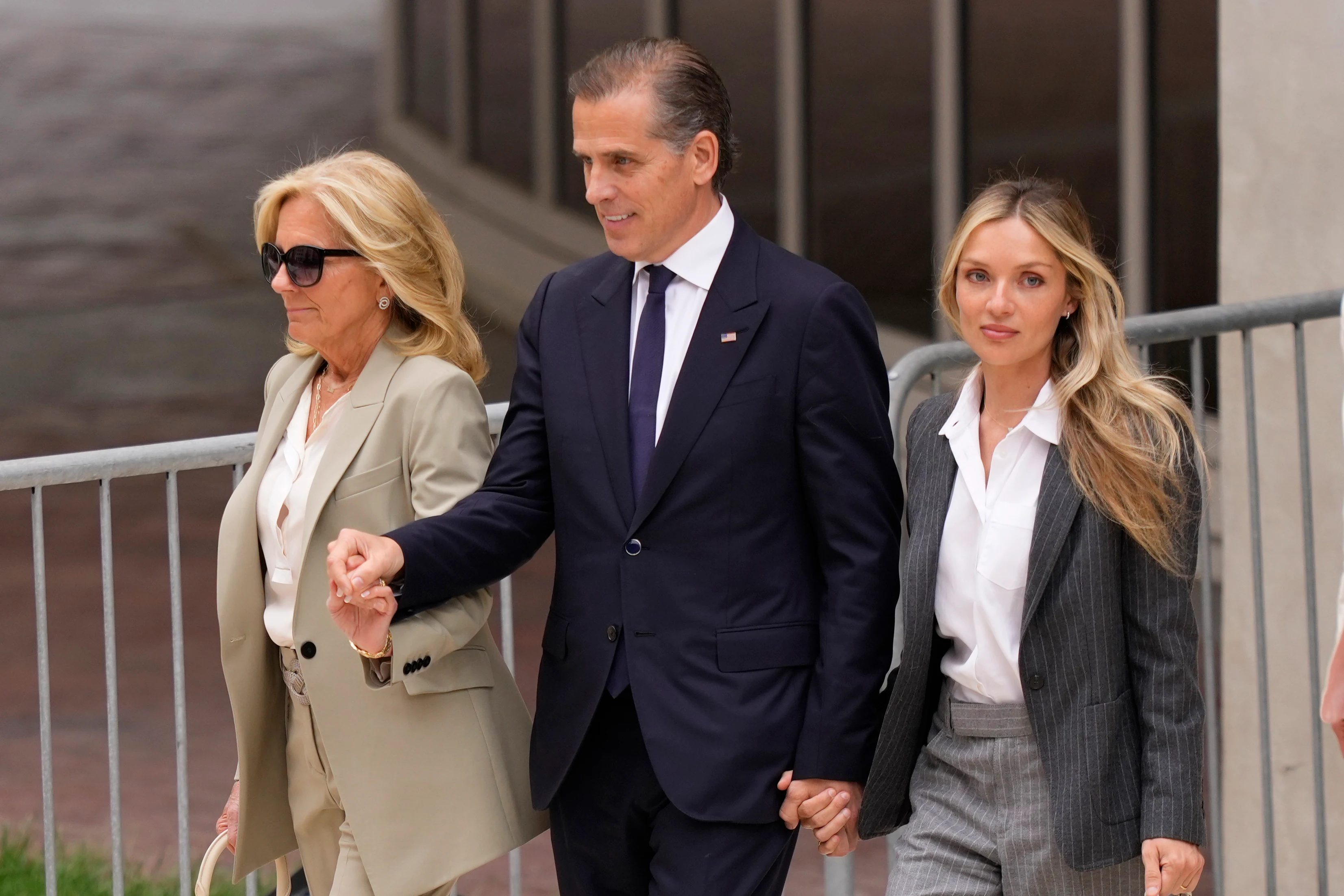 Hunter Biden, President Joe Biden's son, accompanied by his mother, first lady Jill Biden and his wife, Melissa Cohen Biden, walks out of federal court after hearing the guilty verdict on Tuesday in Wilmington, Del.