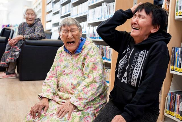 Inuinnaq people laughing together