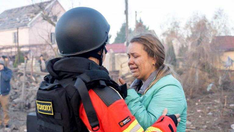 This handout photograph taken and released by the Ukrainian Emergency Service on November 17, 2024 shows a psychologist officer comforting a woman following a missile attack at an undisclosed location in Odesa region. Russia pounded Ukraine with "one of the largest" aerial attacks it has suffered in an assault that targeted the country's energy infrastructure, Kyiv's Foreign Minister Andriy Sybiga said on November 17, 2024. (Photo by Handout / UKRAINIAN EMERGENCY SERVICE / AFP) / RESTRICTED TO EDITORIAL USE - MANDATORY CREDIT "AFP PHOTO / UKRAINIAN EMERGENCY SERVICE" - NO MARKETING NO ADVERTISING CAMPAIGNS - DISTRIBUTED AS A SERVICE TO CLIENTS