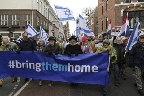 Israeli supporters march next to the International Court of Justice in The Hague, Netherlands.