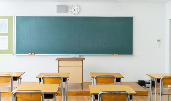 Classroom, desks, chalkboard. (Photo credit: miya227 via Shutterstock) ** FILE **