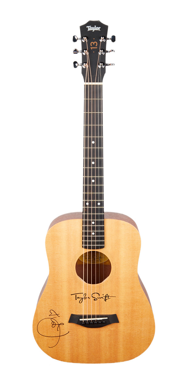 Signature Baby Taylor model acoustic guitar in natural finish signed by Taylor Swift