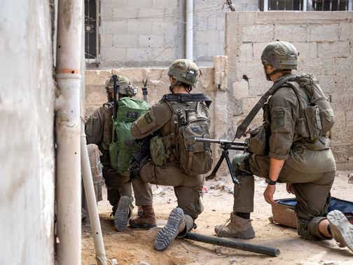 Des soldats israéliens opérant jeudi dans la bande de Gaza.