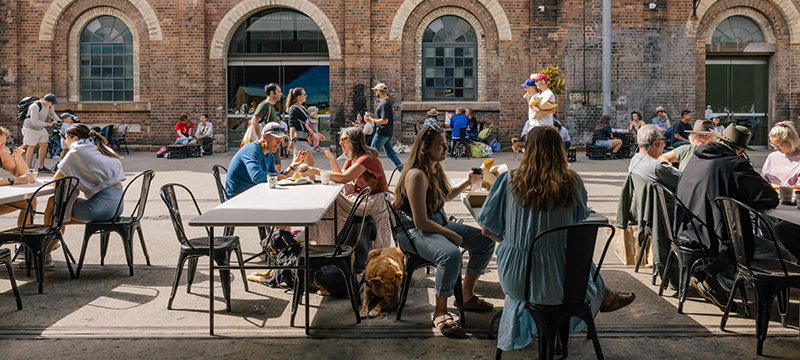 A crowd of people enjoying Carriageworks market atmosphere