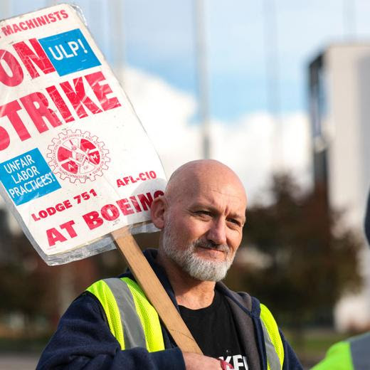 Boeing machinist Andre Johnstone, who says he does not support the new contract offer, pickets outside the Renton Production Facility one day before striking union members will vote on a new contract offer in Renton, Washington on November 3, 2024. US aviation giant Boeing has once again improved the conditions in its contract offer to thousands of striking workers, hoping to put an end to a painful strike that has paralyzed its two main factories for seven weeks. The International Association of Machinists and Aerospace Workers District 751, the union which represents more than 33,000 workers who went on strike on September 13 in the Seattle area, on October 31, 2024 endorsed the new offer and set a vote for November 4, 2024. (Photo by Jason Redmond / AFP)