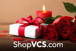 flowers, a gift and a candle for valentine's day