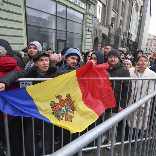 epa11698633 Moldovans living in Russia stand in line at a polling station in the Moldova embassy building during the Moldovan presidential elections in Moscow, Russia, 03 November 2024. Moldova opened two polling stations in Moscow, Russia, according to the Moldovan embassy in Russia's website. Moldova is holding its second round of presidential elections, with former Attorney General of Moldova Alexandr Stoianoglo facing incumbent President of Moldova Maia Sandu. EPA/SERGEI ILNITSKY