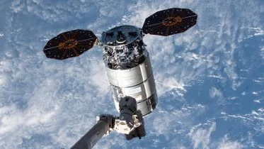 Canadarm2 Robotic Arm Reaches Out Toward Cygnus Space Freighter February 2024