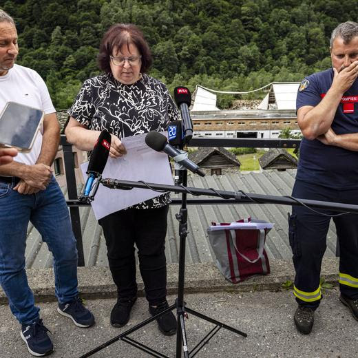 Gabriele Dazio Mayor of Lavizzara, left, Wanda Dadd, President of the municipality of Cevio, center, and Doriano Donati, fire department commander of Lavizzara, right, speak to members of the media in Prato Sornico, Lavizzara in the Maggia Valley, southern Switzerland on Wednesday July 3, 2024. Severe storms and torrential rain over the last weekend left five people dead in Switzerland's Val Maggia and its side valleys in Ticino. (KEYSTONE/Michael Buholzer).