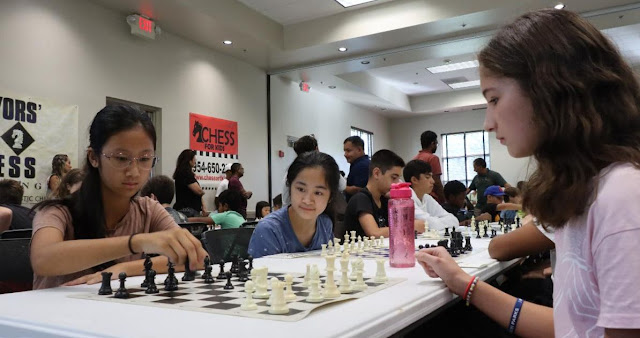 Girls concentrate on a chess match at the Weston Community Center on October 7 2023