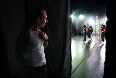 Joe Lanteri, left, watching a New York City Dance Alliance convention and competition in Lansing, Mich., in January.