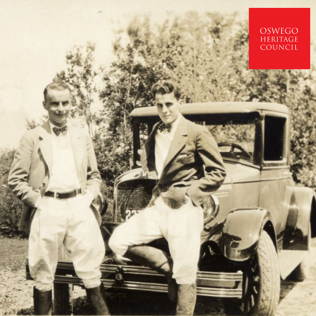 1930s photograph of two young men in front of a vehicle