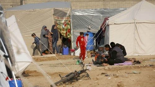 Palestinians living in tents in the central Gazan city of Deir al-Balah