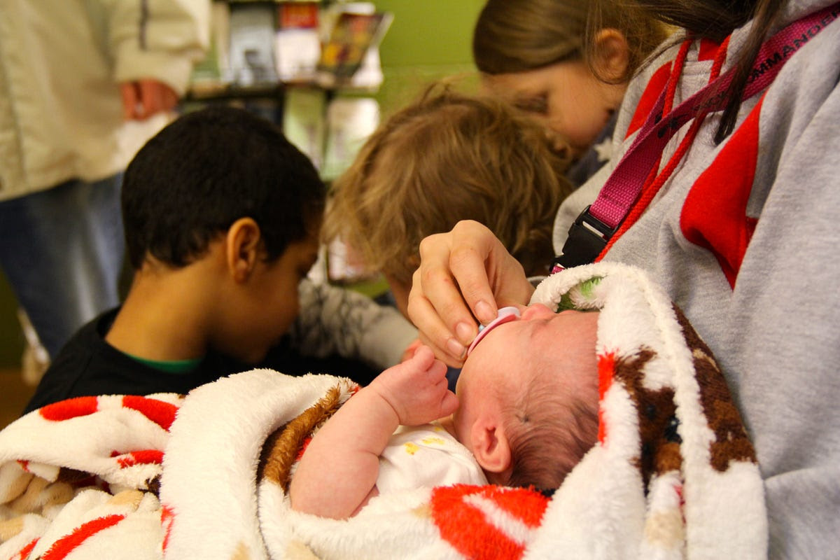 This family awaited assistance at a shelter. Photo Diane Nilan